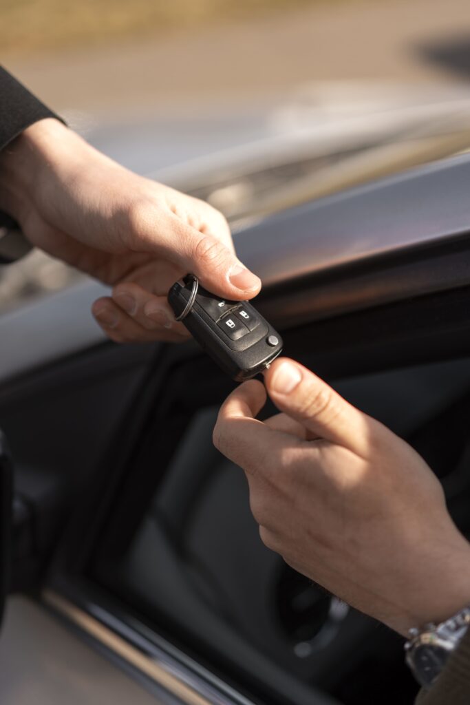 high angle hands holding car key